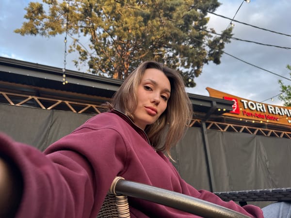 Woman photographed at outdoor restaurant in casual portrait session