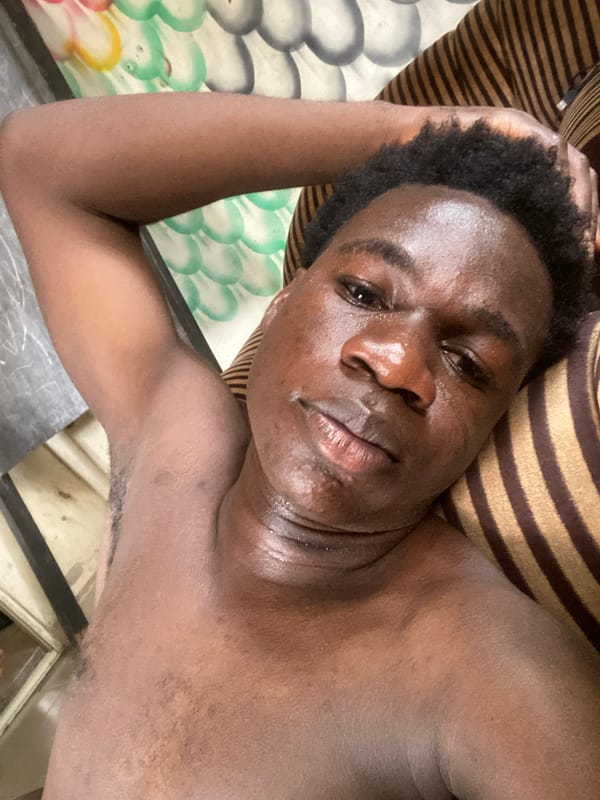Young man photographed with Nigerian currency in Mararaba