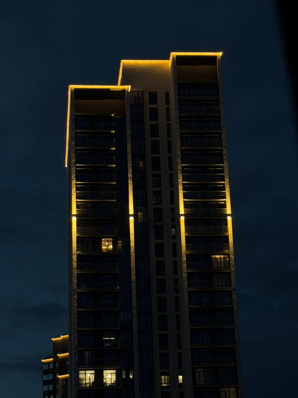 Yekaterinburg high-rises glow with golden edge lighting at night