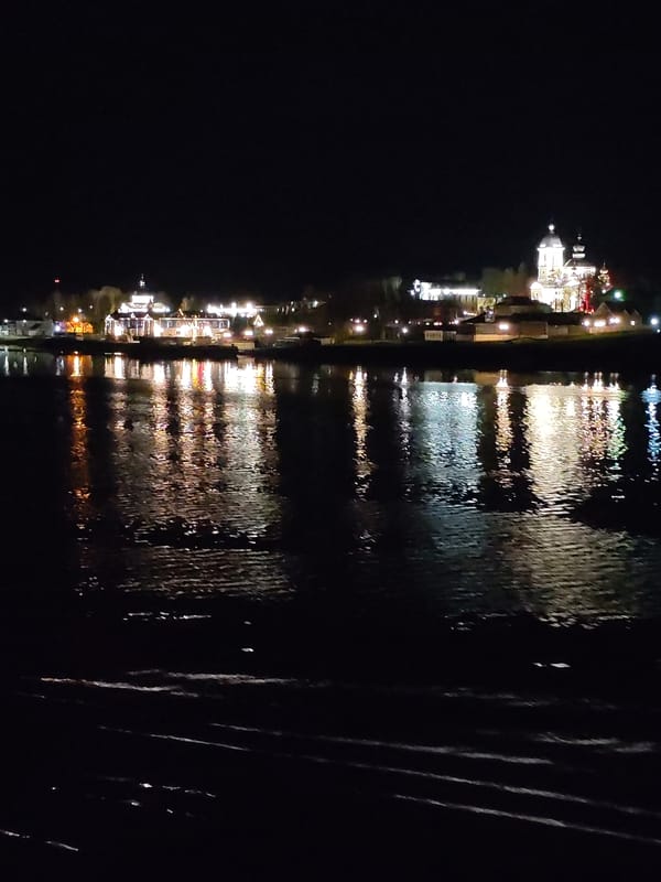 Nighttime waterfront reflections documented in Nesterovo, Russia