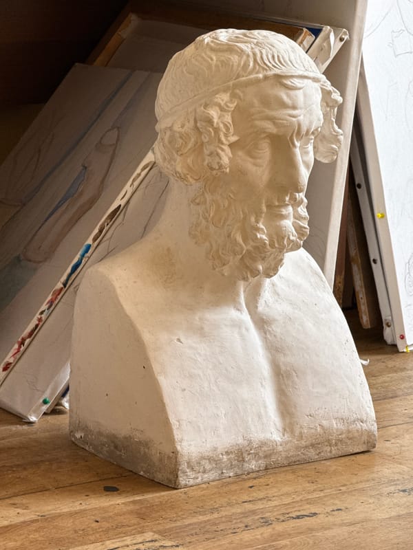 Artist studio documented in Yerevan showing sculptures and paintings