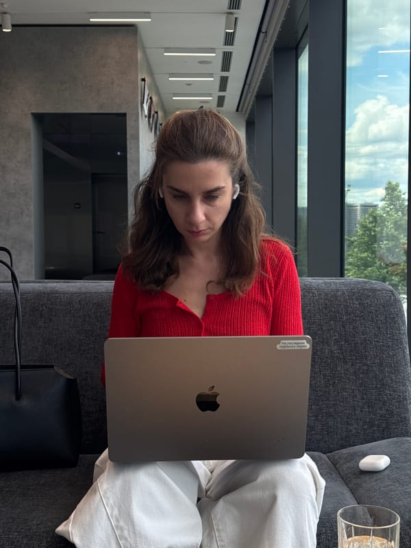 Woman works on laptop in Moscow office lounge