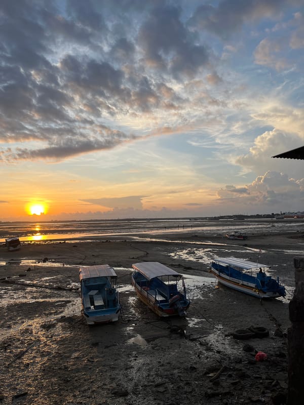 Sunset photographs capture tidal flats scene in Kuta Selatan