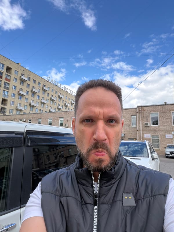 Man takes selfie near Saint Petersburg residential building
