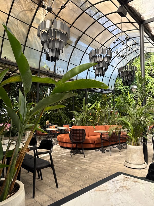 Glass-domed restaurant with tropical design observed in Ubud