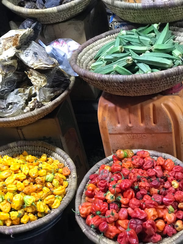 Evening market vendor sells traditional produce in Abuja Nigeria
