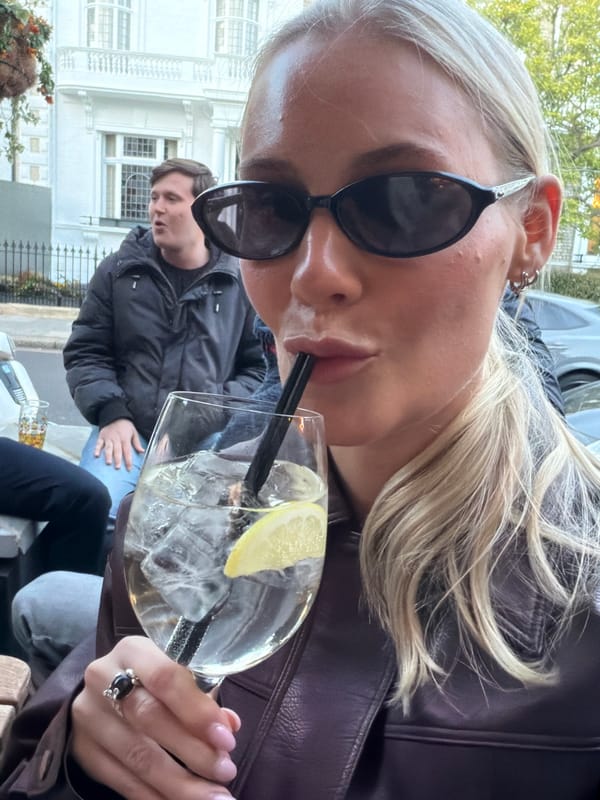 Evening social gathering at London pub features outdoor drinks