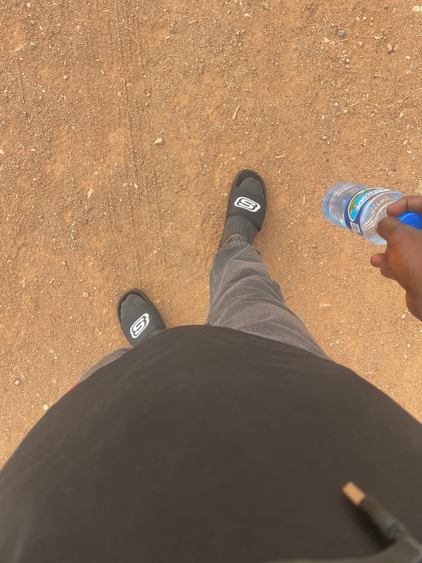 Daily life documented in Jos: water break, evening food stall
