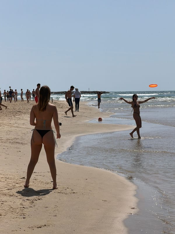 Tel Aviv beachgoers enjoy acrobatics and soccer activities
