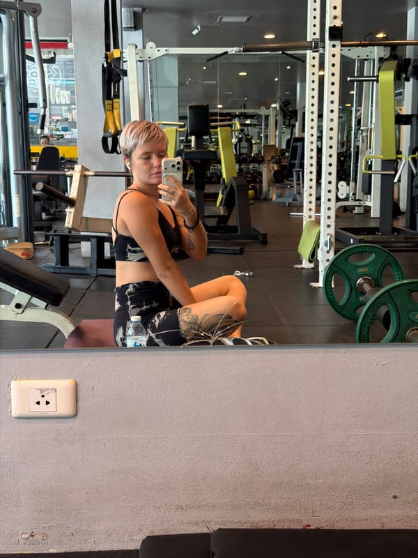 Woman takes gym mirror selfie in Thep Krasatti Thailand
