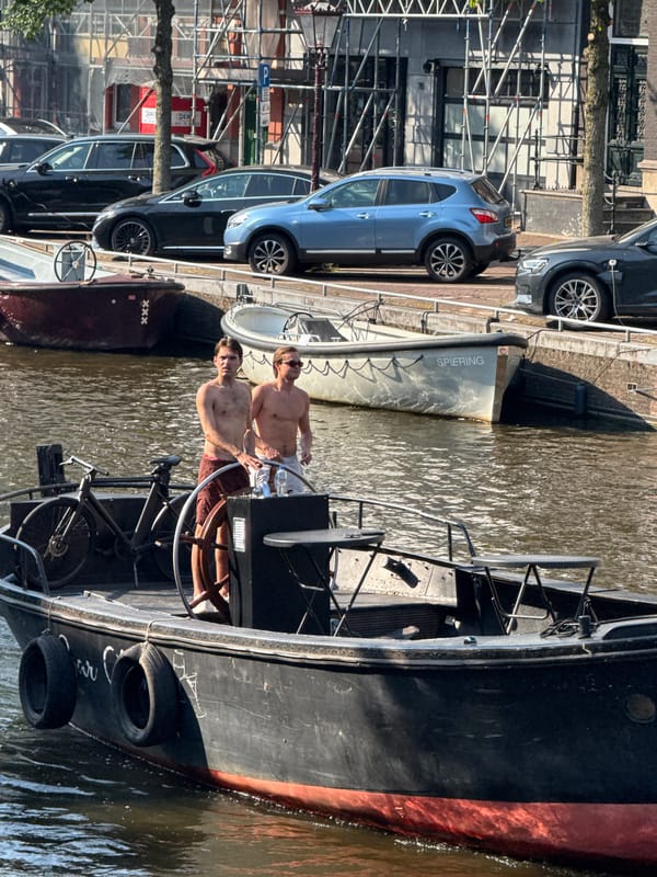 Sunny afternoon on Amsterdam's canals and streets