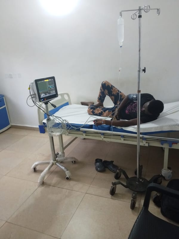 Young man hospitalized with IV, monitors in Sabon Tasha
