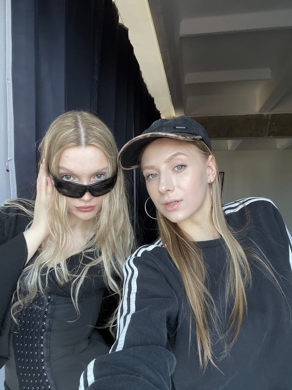 Two women photographed in indoor stairwell in Krasnoyarsk