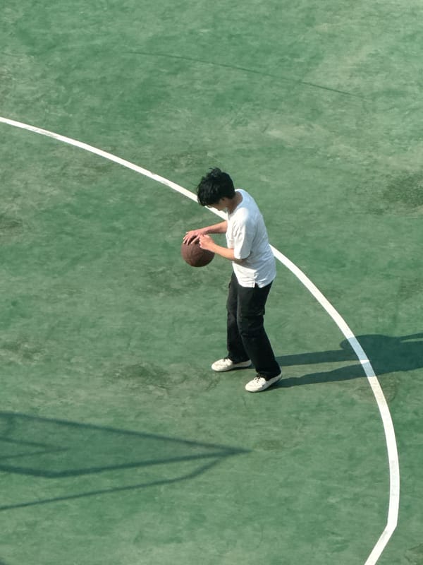 Morning basketball session at outdoor court in Beijing