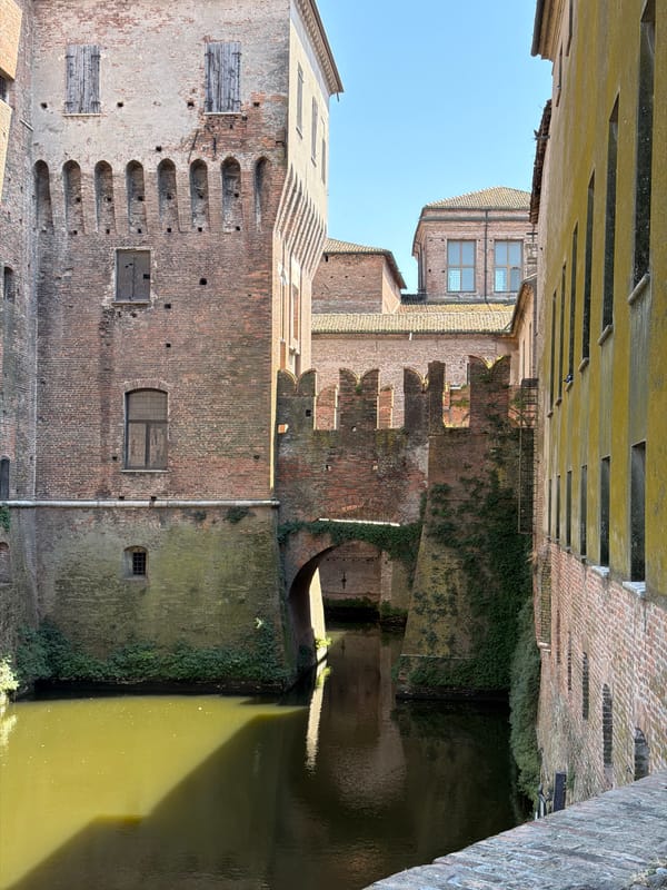 Tourist photographs medieval castle fortress in Mantua, Italy