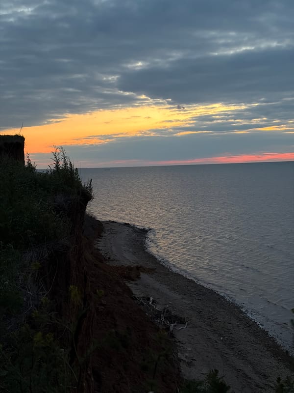 Sunset observed over coastal waters near Port-Katon, Russia