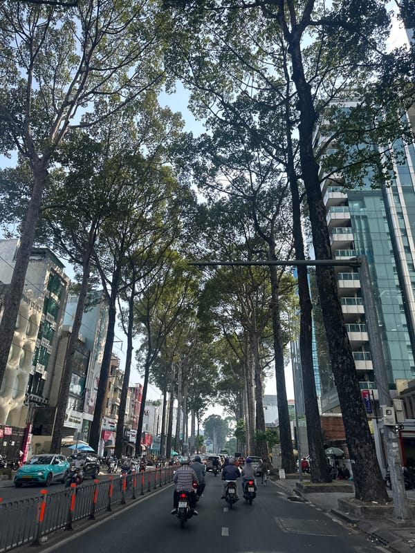 Morning street scene captured near Paris Baguette in Thủ Đức