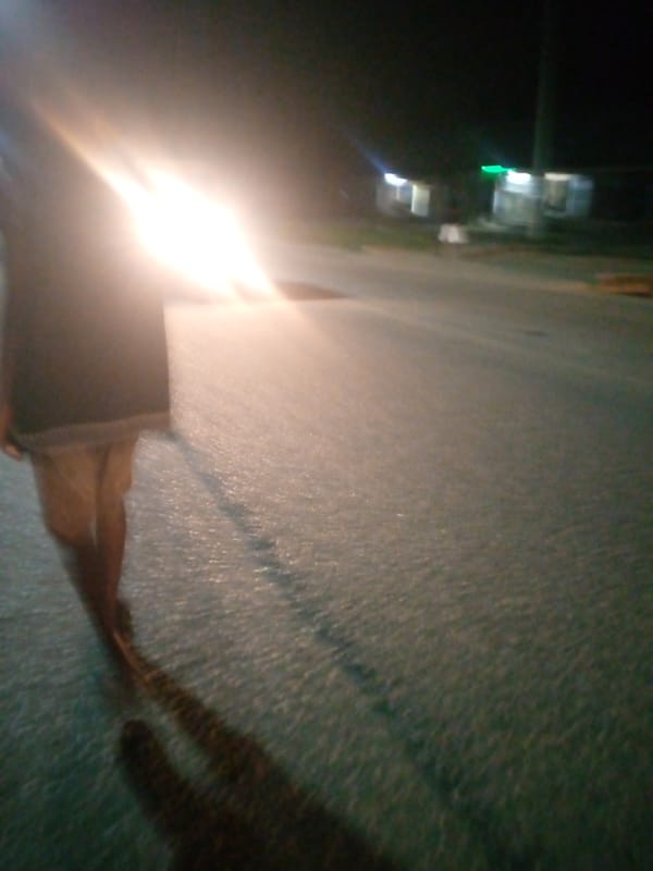 Jalingo streets after dark: shops, stalls, and traffic