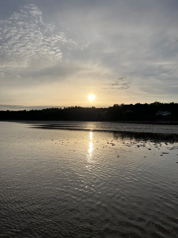 Sunset over a tidal estuary in Mountcharles, Ireland