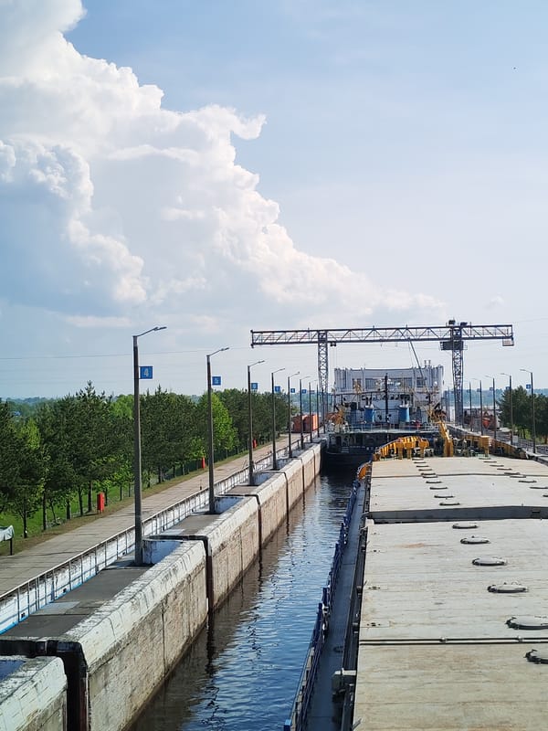 Barge transits Volga-Baltic Waterway lock at Sheksna, Russia