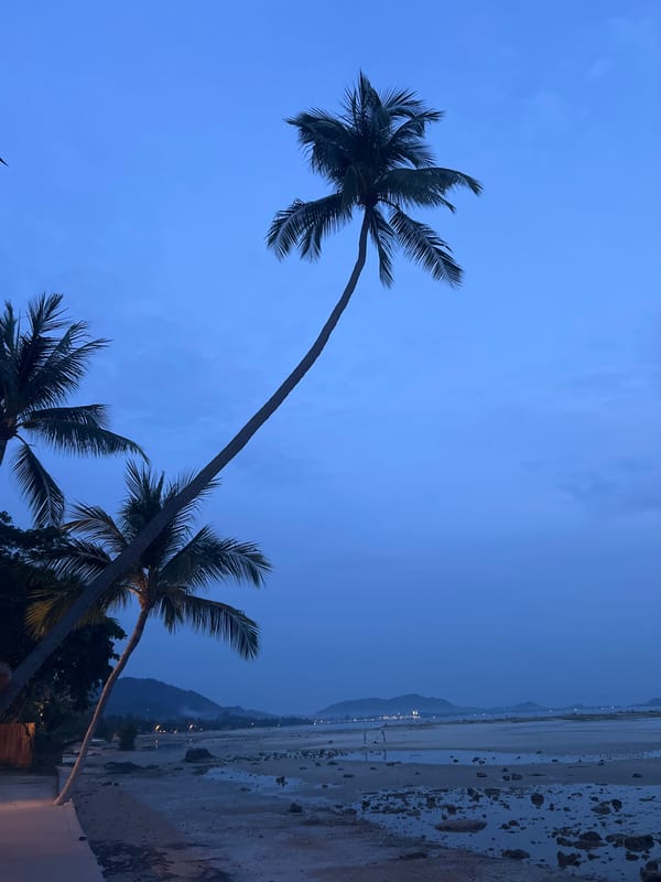 Evening poolside scene captured in coastal Baan Thong Po