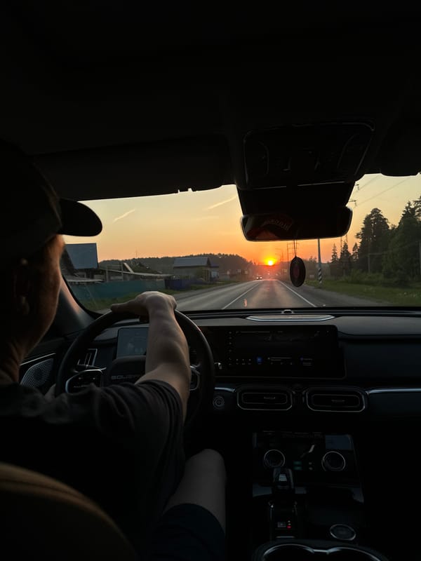 Driver captures sunset view on road near Chaikovsky
