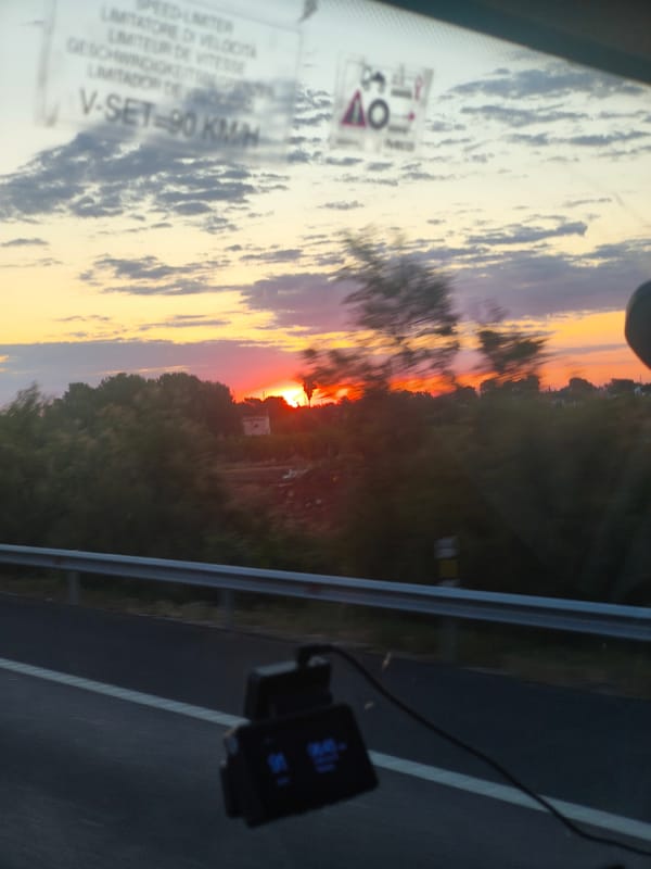 Colorful sunrise captured from vehicle near Valencia, Spain