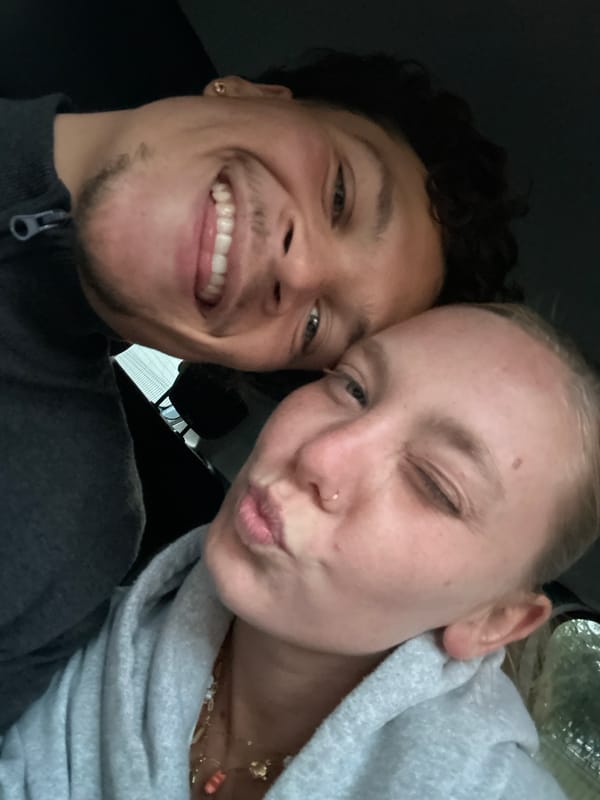 Young couple shares playful selfie moment in Lannoy car