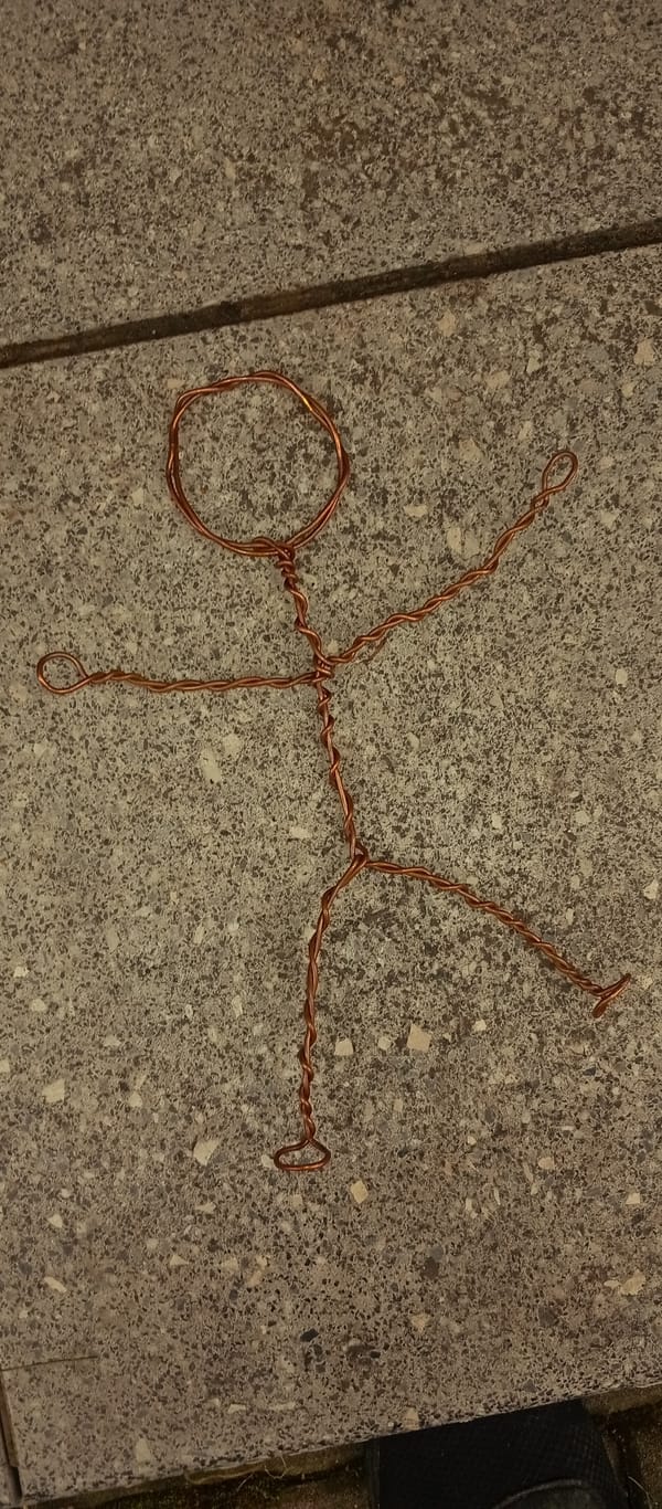 Copper wire stick figure spotted around a Karviná park