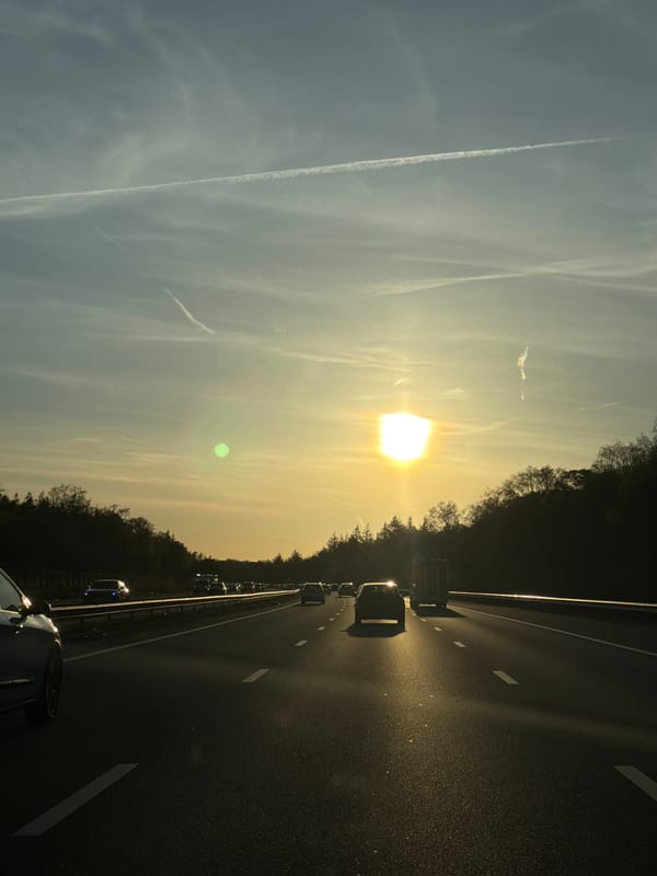 Evening traffic flows on Arnhem highway during sunset
