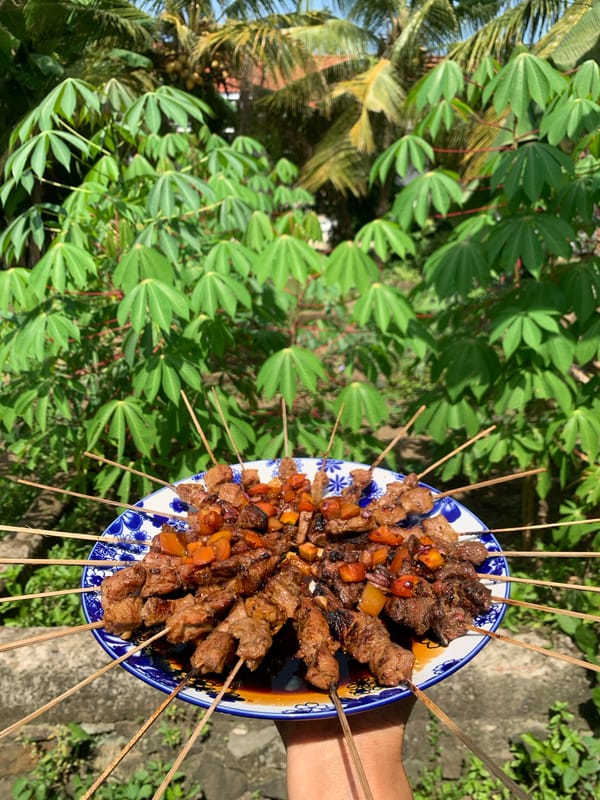 Early morning satay preparation documented in Karangkemiri, Indonesia