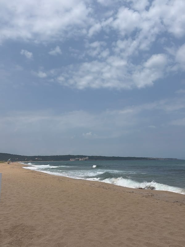 Laid-back beach day with waves, shade, and shoreline strolls