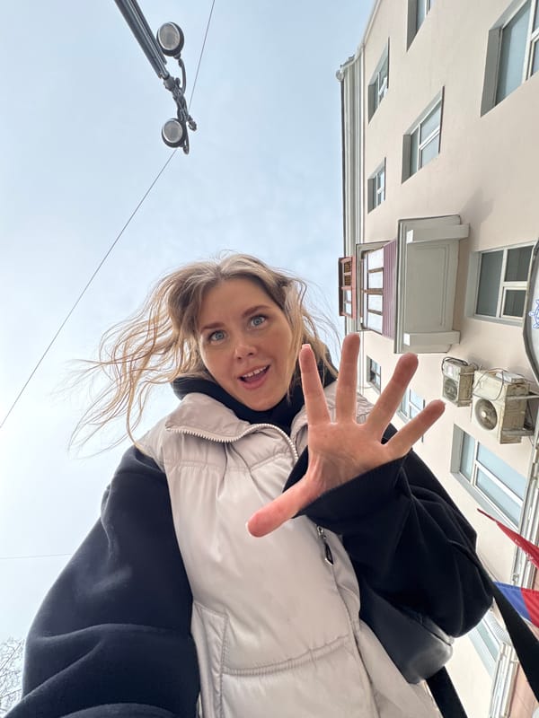 Woman takes selfies near construction work in Perm, Russia
