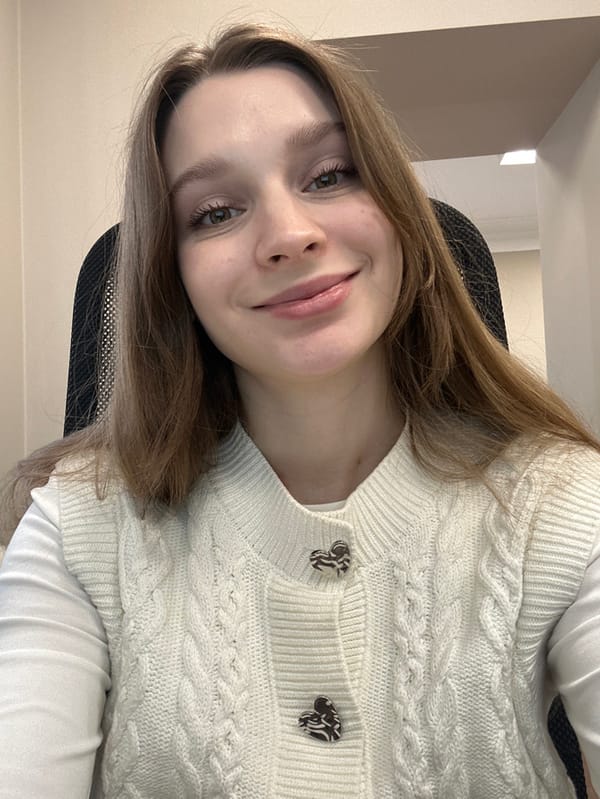 Woman takes morning selfies in cream cardigan in Kazan