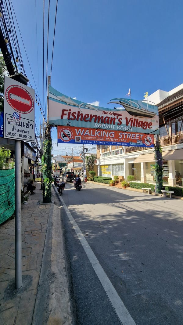 Tourist documents Fisherman's Village and Buddha statue in Thailand
