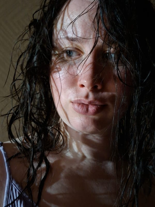 Unidentified person with wet hair captured in tilted close-up