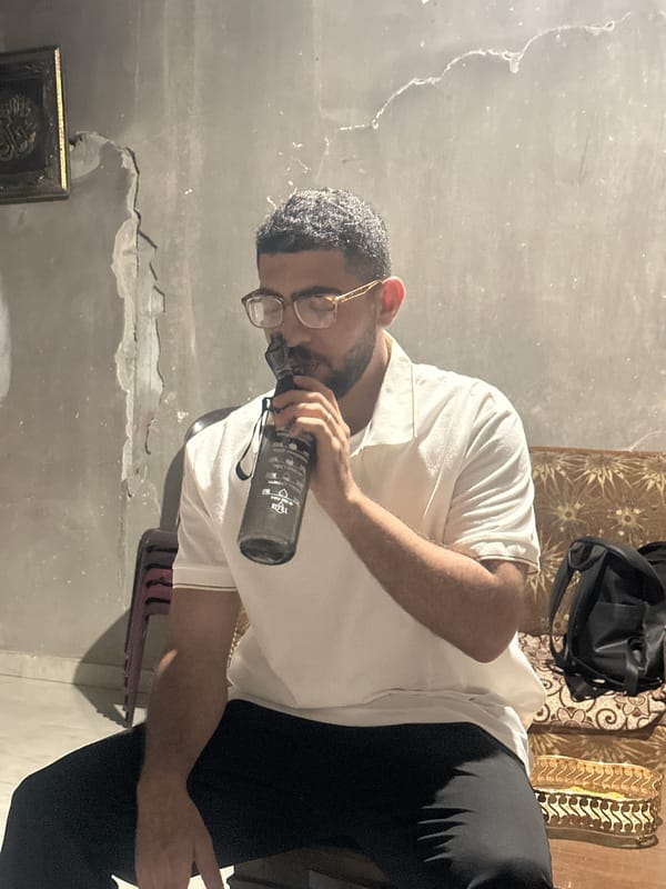 Gaza residents observed during evening hours, one indoors, one outdoors
