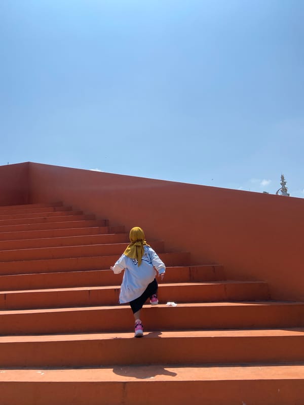Person in yellow hijab visits public recreational space in Sidoarjo