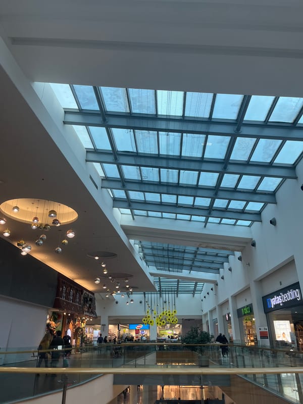 Porsche 911 displayed in modern Varna shopping mall showroom