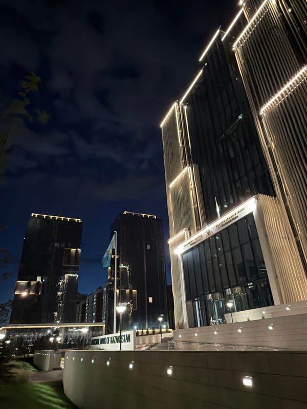 Night drive through Astana's lit streets and landmarks