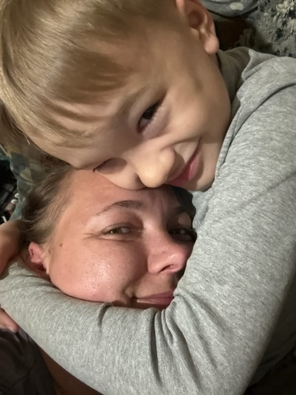 Child and adult share tender moment in Dmitrov