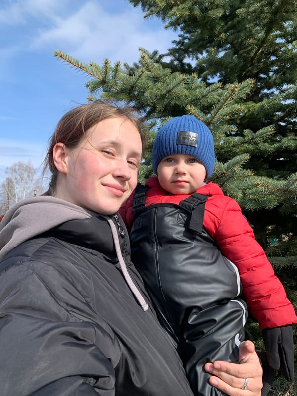Mother and child enjoy playground time in Фоки, Russia