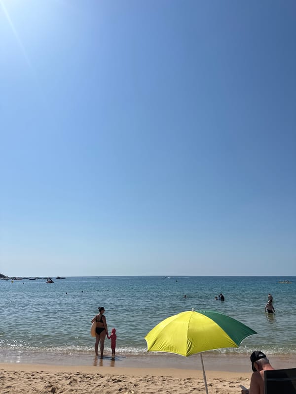 Crowded summer beach day at Sant Feliu de Guíxols, Costa Brava