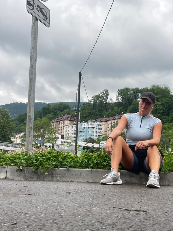 Woman jogs, rests during early morning exercise in Sochi