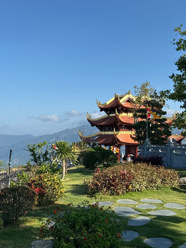Visitor documents traditional pagoda and Buddha statue in Nha Trang