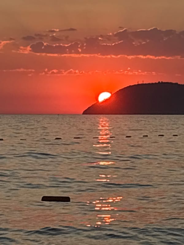 Adriatic sunset from Bar, Montenegro — warm skies, calm water