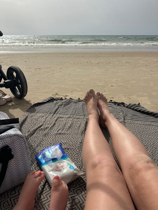 Family enjoys beach day with toddler near Tel Aviv
