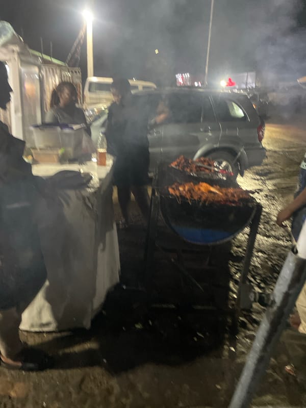 Late-night suya stop at a street grill in Abuja