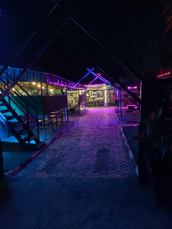 Neon-lit outdoor restaurant documented in Gura Top, Nigeria