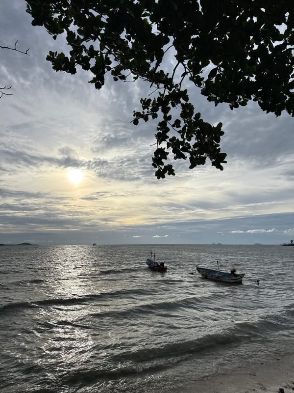 Overcast shoreline on Ko Samui, waves meeting the sand